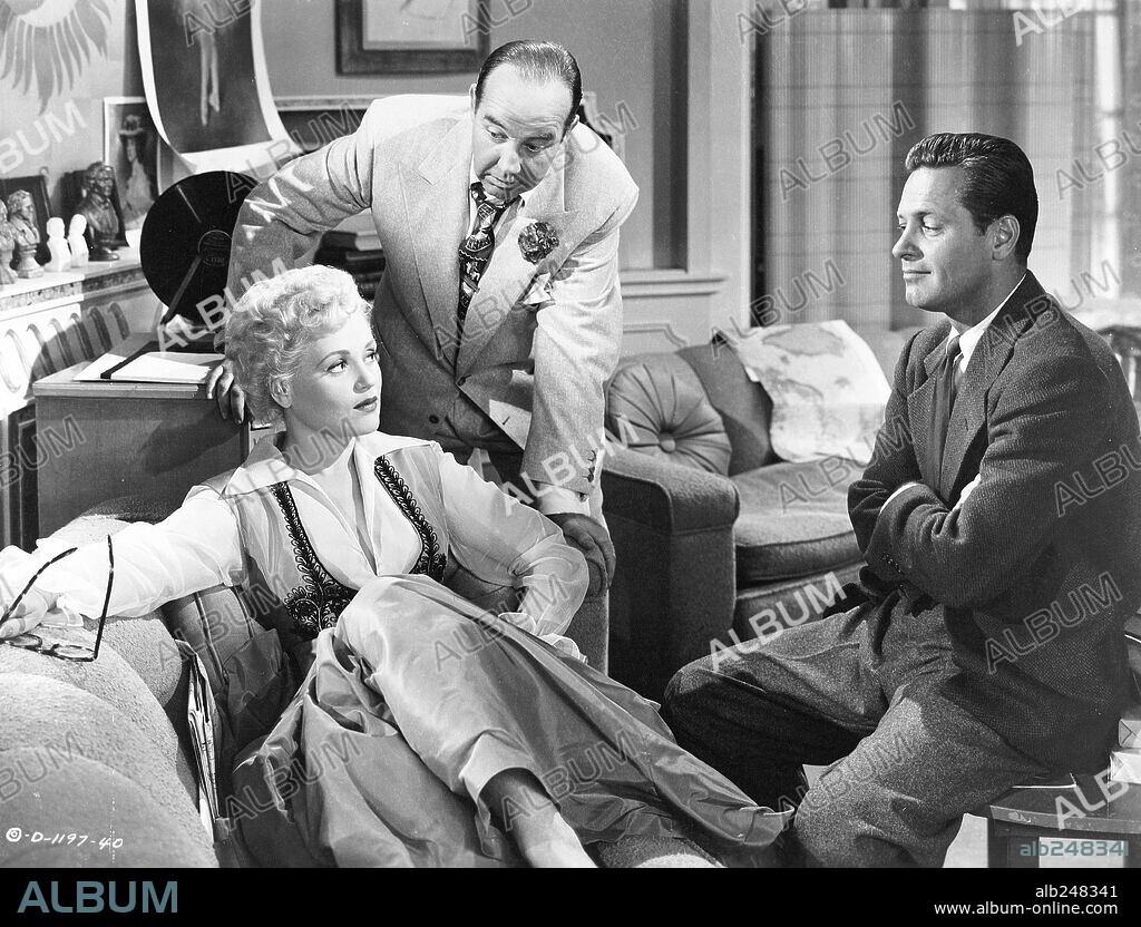 BRODERICK CRAWFORD, JUDY HOLLIDAY and WILLIAM HOLDEN in BORN YESTERDAY, 1950, directed by GEORGE CUKOR. Copyright COLUMBIA PICTURES.