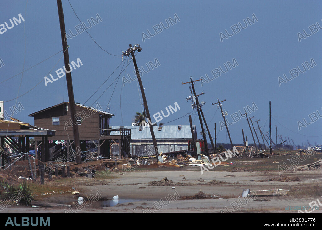 Hurricane Alicia Damage to power lines leaning along Galveston West Beach. Texas; 8/18/83.