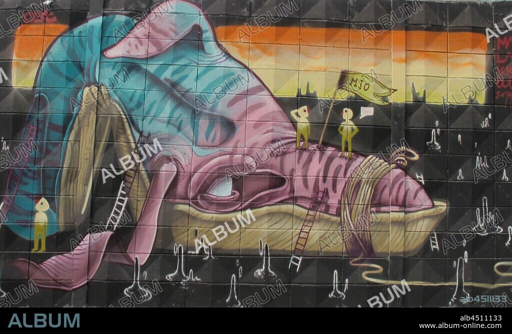 ilustracion de ballena rodeada de pequeños hombrecitos sobre un mar de petroleo, graffiti mural, Plaza de las Glorias; Distrito San Martin, Barcelona en 2014.