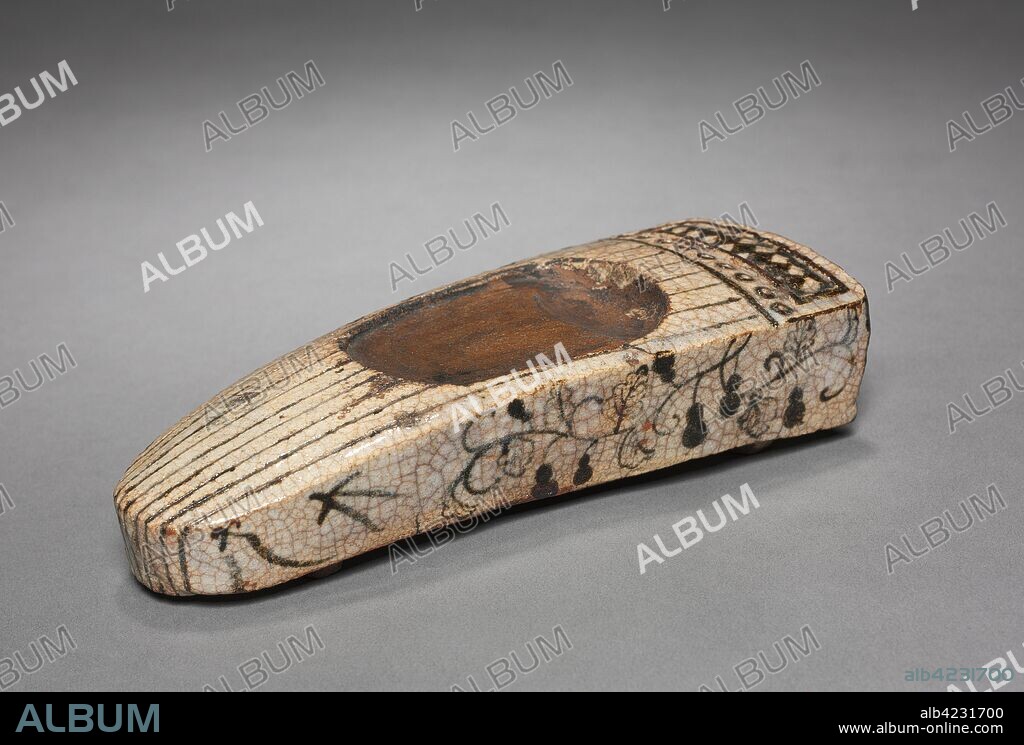 Inkstone in the Form of a Koto, 1600s. Japan, Gifu Prefecture, Mino kilns, Momoyama (1573-1615)-Edo period (1615-1868). Shino ware with underglaze iron decoration; overall: 4.4 x 19.2 x 7 cm (1 3/4 x 7 9/16 x 2 3/4 in.).