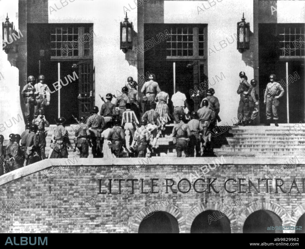 Little Rock, Arkansas 1957, Escorted by 101st Airborne U.S. Army troops, the Little Rock Nine enter through the front door of Central High School.