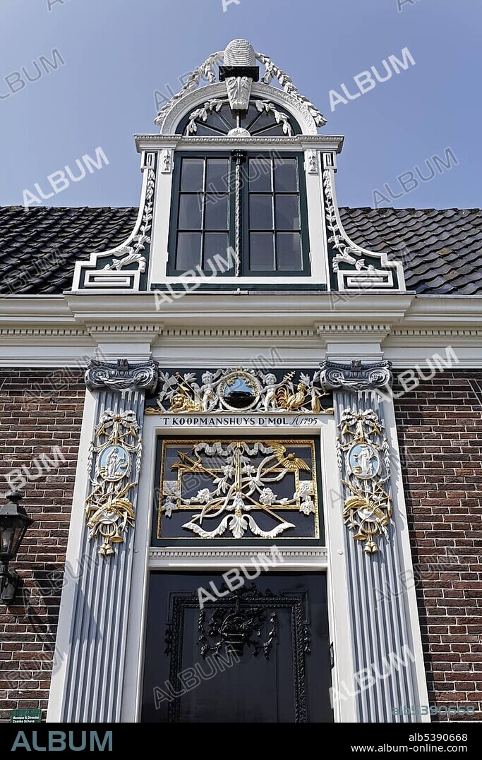 Portal of a Dutch merchant house from the 18th century, richly decorated, open-air museum Zaanse Schans, Zaandam, North Holland, Netherlands, Europe.