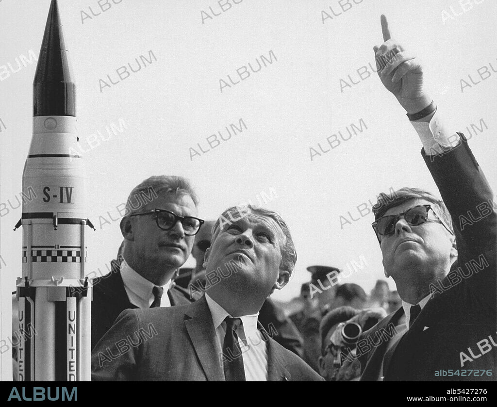 Seamans, von Braun and President Kennedy at Cape Canaveral, Florida, USA, 1963. Dr. Wernher von Braun (center) explains the Saturn Launch System to President John F. Kennedy. NASA Deputy Administrator Robert Seamans is to the left of von Braun.