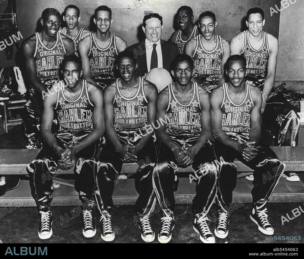 Harlem Globetrotters Cirole the World - These members of the Harlem Globetrotters professional basketball team from the United States, made a trip around the world in 1952, playing games in 87 cities in 34 countries. They are, left to right in the front row, Ermer Robinson, Clarence Wilson, Marques Haynes and Josh Grider. Back row, left to right, are Reace Tatum, William Garrett, Bill Brown, Abe Saperstein who has been the Globetrotters' coach since their team was organized in 1927, Louis Presaley, Blains Denning and Charles Cooper. December 30, 1953. (Photo by United States Information Center).