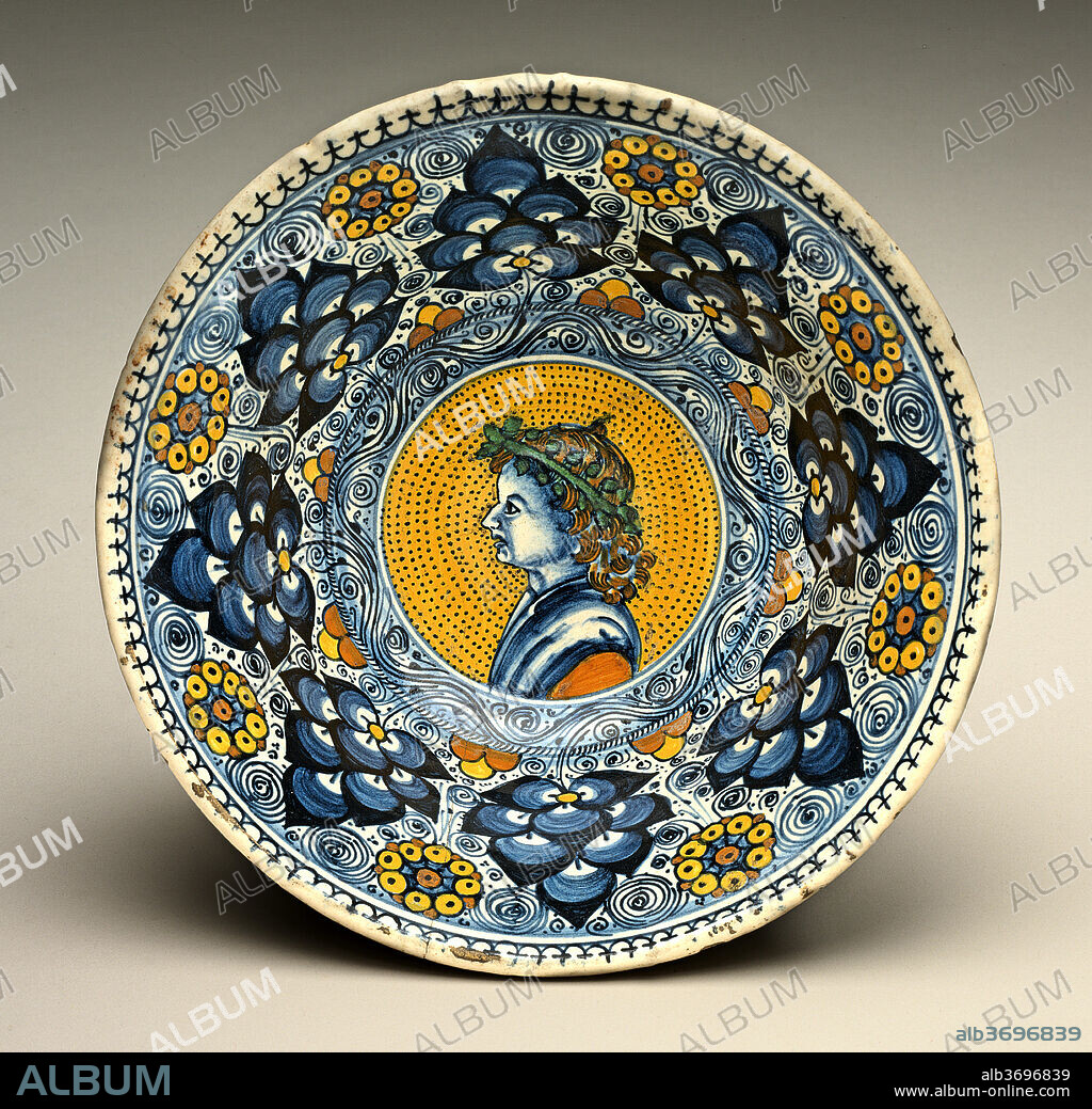 PROBABLY TUSCAN OR FAENTINE 16TH CENTURY. Deep bowl with "Persian palmette" ornament; in the center, a profile bust of a young man wearing a wreath. Dated: c. 1490/1500. Dimensions: overall (diameter): 15.5 cm (6 1/8 in.). Medium: tin-glazed earthenware (maiolica).