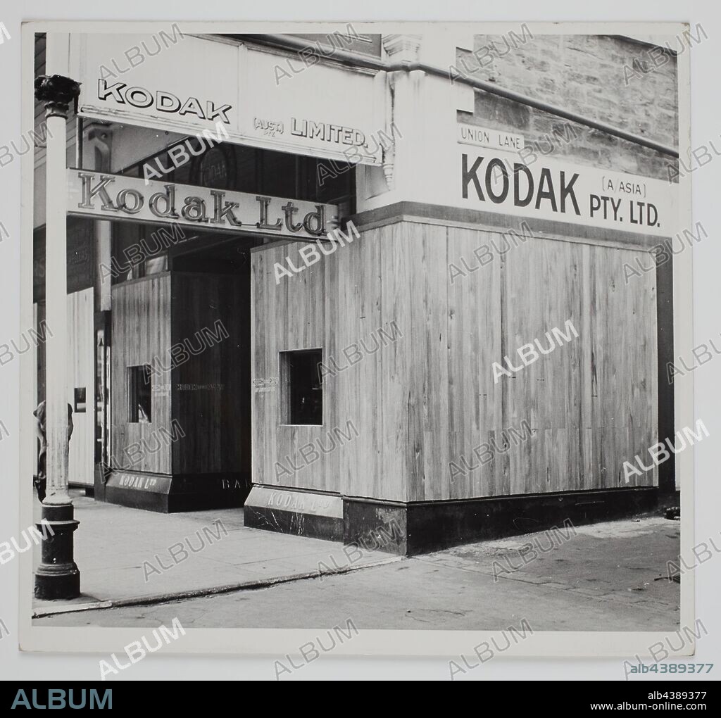 Photograph, Shopfront Window Hoarding, Adelaide, South Australia, circa 1940s, Black & white photograph of the Kodak Australasia Pty Ltd store in Rundle Street, Adelaide, South Australia, circa 1940s, prior to a renovation and modernisation which involved painting the building white. collection of products, promotional materials, photographs and working life artefacts, when the Melbourne manufacturing.