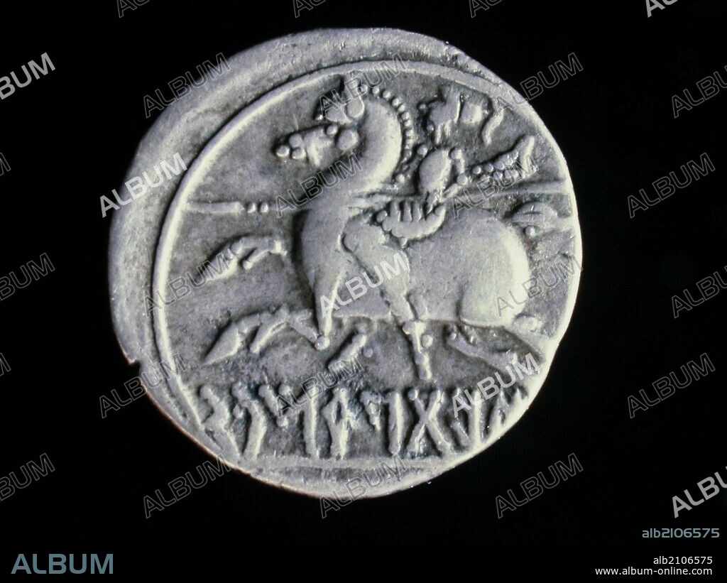 NUMISMATICA. MONEDA IBERICA. DENARIO DE PLATA. REVERSO. JINETE CON LANZA GALOPANDO A LA DERECHA. 100 A.C. (DEPOSITO: MUSEO ARQUEOLOGICO NACIONAL).