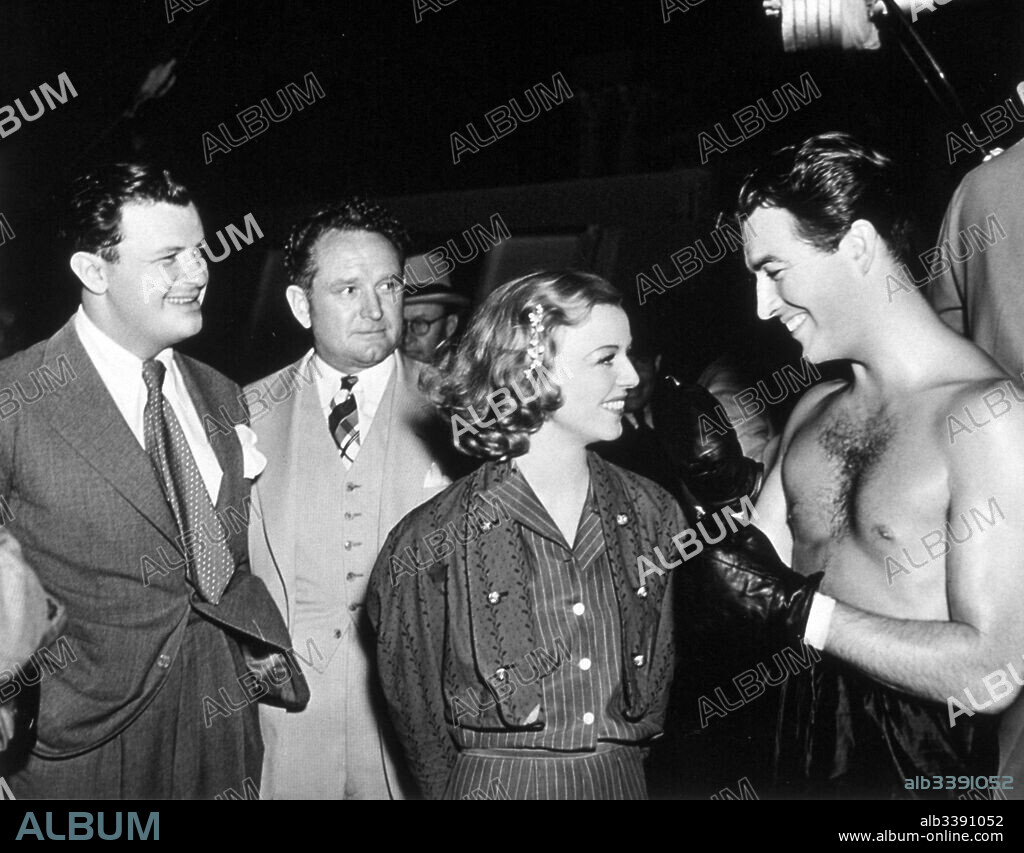 FRANK BORZAGE, MANKIEWICZ JOSEPH L, MARGARET SULLAVAN and ROBERT TAYLOR. FRANK BORZAGE, JOSEPH L. MANKIEWICZ, MARGARET SULLAVAN and ROBERT TAYLOR in THE CROWD ROARS, 1938, directed by RICHARD THORPE. Copyright M.G.M.
