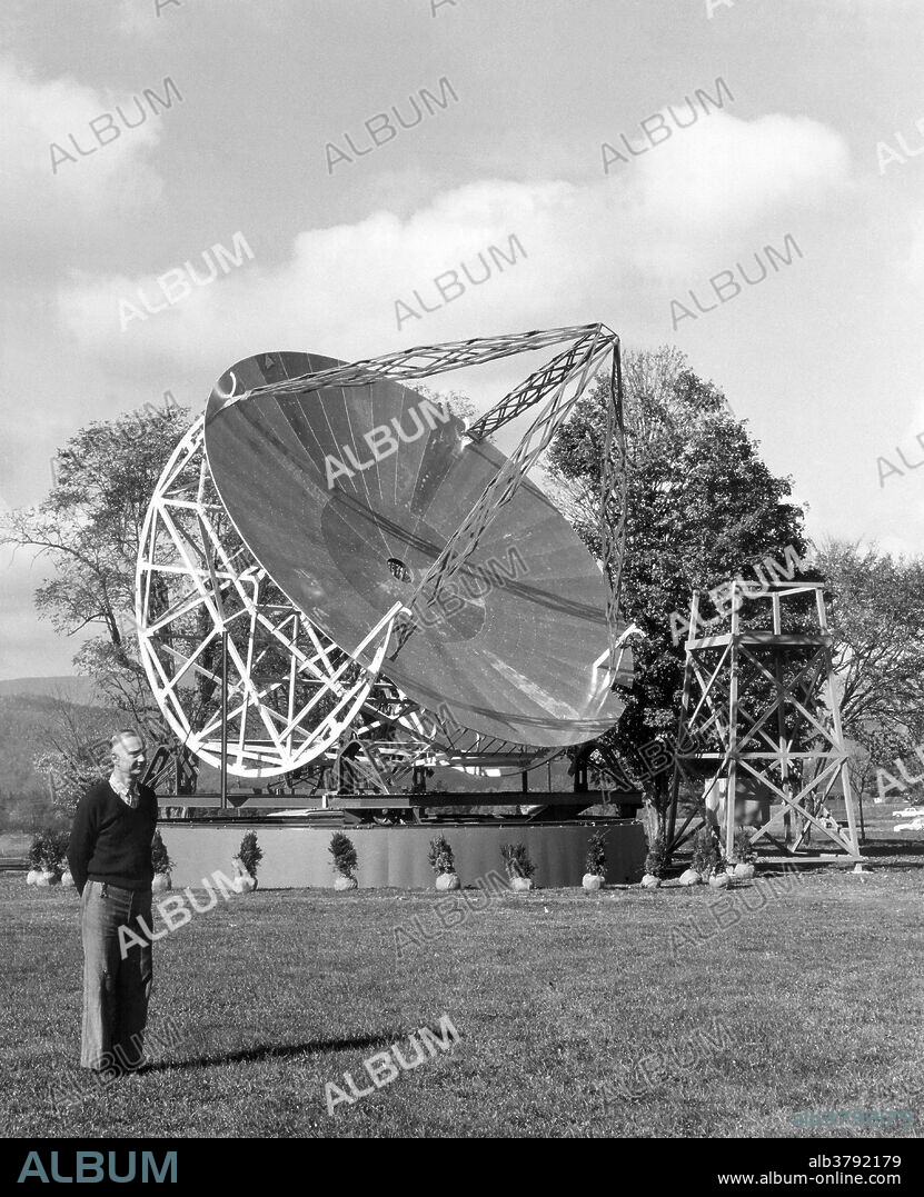 Reber posing with his and first radio telescope. He sold his telescope to the National Bureau of Standards, and it was erected on a turntable at their field station in Sterling, Virginia. Eventually the telescope made its way to NRAO in Green Bank, West Virginia, and Reber supervised its reconstruction at that site. Grote Reber (December 22, 1911 - December 20, 2002) was a pioneer of radio astronomy. He was instrumental in investigating and extending Karl Jansky's work, and conducted the first sky survey in the radio frequencies. In the summer of 1937, he built his own radio telescope in his back yard. His first receiver operated at 3300 MHz and failed to detect signals from outer space, as did his second, operating at 900 MHz. Finally, his third attempt, at 160 MHz, was successful in 1938, confirming Jansky's discovery. He turned his attention to making a radio-frequency sky map, which he completed in 1941 and extended in 1943. He published a considerable body of work during this era, and was the initiator of the "explosion" of radio astronomy in the immediate post-WWII era. His data, published as contour maps showing the brightness of the sky in radio wavelengths, revealed the existence of radio sources such as Cygnus A and Cassiopeia A for the first time. He died in 2002, two days before his 91st birthday. Photographed in 1960 at the National Radio Astronomy Observatory (NRAO) in West Virginia.