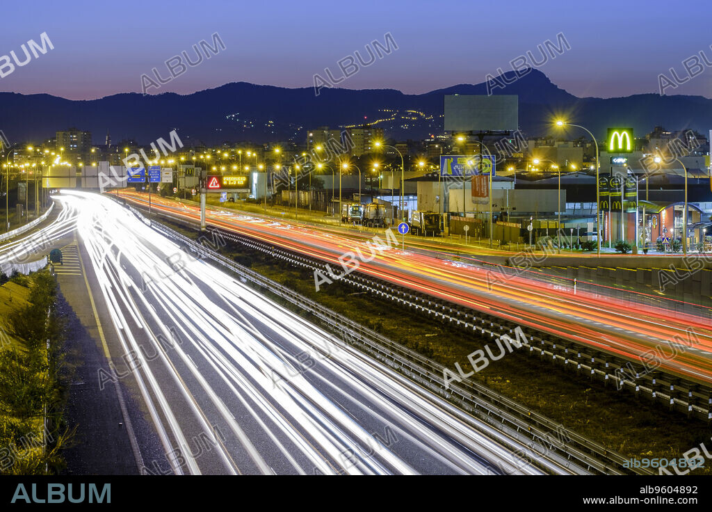 Nighttime vehicle lights on La-19, Levante Highway, Palma, Mallorca, Balearic Islands, Spain, Europe.