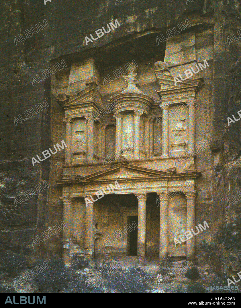 Petra, Jordan, rock-hewn capital of the Nabataens, c100 BC, 'A rose-red city half as old as Time'. The facade of the treasury. Early 20th century photograph. Archaeology.