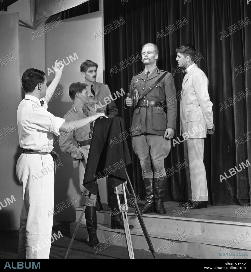 A scene from the Terence Rattigan play, Ross, Worksop College, Nottinghamshire, 1963. The play is a biographical play of TE Lawrence (Lawrence of Arabia). Some of the play is set in flashback and is centered around the exploits of Lawrence in the deserts of the Middle East during the First World War, where the character first appears as 'Aircraftsman Ross'. The cast were members of the theatrical group at Worksop College.