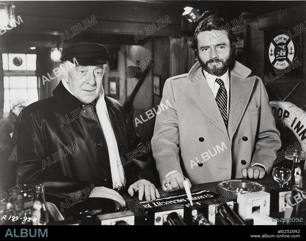 ALEC GUINNESS and RICHARD JORDAN in RAISE THE TITANIC, 1980, directed by JERRY JAMESON. Copyright ASSOCIATED FILM DISTRIBUTION.