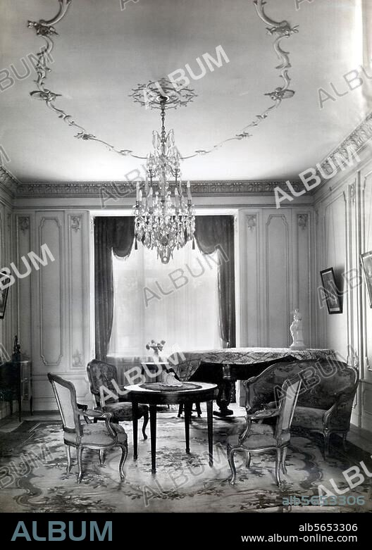 Home:. Living room. Living and music room with Louis-Quinze furnishings. Photo, c. 1910.
