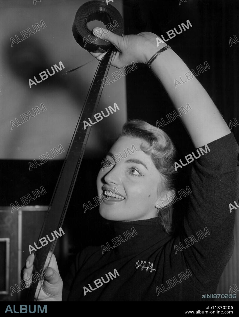 Underwater explorer Lotte Hass view the film of their latest adventures beneath the Red Sea . 26 January 1956.