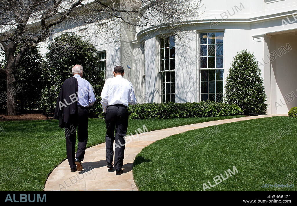 President Barack Obama and Vice President  Joe Biden walk back to the Oval Office after putting on the White House putting green April 24, 2009..
