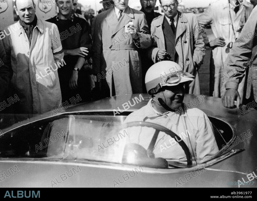 Hermann Lang in a Mercedes Benz 300 SL, Nurburgring 1000km, 1952. He first started racing motorcycle sidecars. In 1933 he joined the engineering division of Mercedes and began as a test driver. In the 1934 season he was given the position of race mechanic to Luigi Fagioli,and was promoted to the race team for the 1935 season. In 1939 he won at Pau, won for the third time at Tripoli, and won in the Eifelrennen. He rejoined the Mercedes team after the war in 1951, and not only came first at Nurburgring in 1952 but also won the Le Mans 24 Hour race.