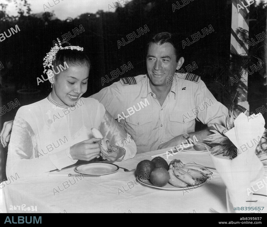 Win Min Than and her co-star Gregory Peck, who are appearing in J. Arthur Rank's film without kisses, The Purple Plain. August 6, 1954. (Photo by J. Arthur Rank Organisation Ltd.).
