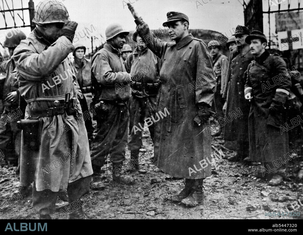Last Nazi Fortress at Metz Surrenders to U.S. Troops. An American brigadier general (left) of the third U.S. Army salutes as he leaves Fort Jeanne d'Arc, last enemy strongpoint guarding Motz, Eastern France. The assistant commander of the German garrison which surrendered December 13, 1944, gives the Nazi salute as he is taken into captivity with a force of 500. The fortress capitulated 21 days after the city of Metz was liberated. January 31, 1945. (Photo by U.S. Office of War Information Photo).