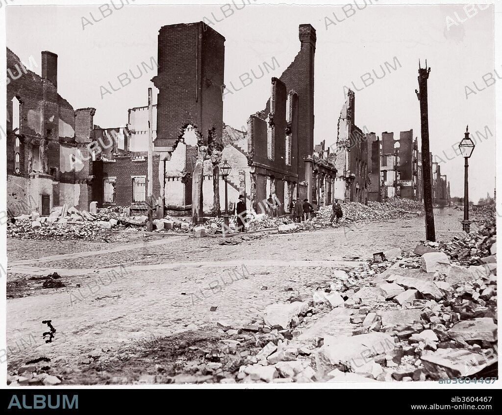 Ruins in Carey Street, Richmond. Artist: Alexander Gardner (American, Glasgow, Scotland 1821-1882 Washington, D.C.); Thomas C. Roche (American, 1826-1895). Dimensions: Image: 18.6 x 23.8 cm (7 5/16 x 9 3/8 in.). Former Attribution: Formerly attributed to Mathew B. Brady (American, born Ireland, 1823?-1896 New York). Date: 1865.
Very little is known of the early career of Thomas C. Roche. During the Civil War he worked for E. & H. T. Anthony Company, New York, publishers of cartes-de-visite and stereoscopic views and distributors of photographic supplies. In early April 1865, near the war's end, Roche received special orders from Anthony to work for General Montgomery Meigs. As quartermaster of the Union Army, Meigs was responsible for the procurement and transportation of everything from bootlaces to artillery. He was also an amateur photographer and recognized the military usefulness of documentary photography. This view shows the ruins of Richmond, Virginia, the capital of the Confederacy, soon after Jefferson Davis and his Confederate cabinet evacuated the city on April 3, 1865. Fires intentionally set by fleeing Confederates and looters destroyed much of the city otherwise untouched by the Union Army. On April 9, General Robert E. Lee surrendered to General Ulysses S. Grant, effectively putting an end to the Confederacy and then, a few weeks later, the Civil War.