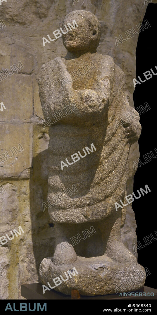 Roman statue depicting a man in toga. Granite. Provenance unknown. In the 16th century it was placed at the mouth of the Douro River, Portugal. Carmo Archaeological Museum. Lisbon, Portugal.