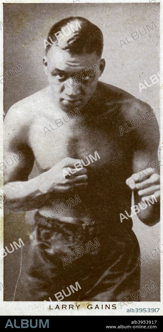 Larry Gains, Canadian boxer, 1938. A heavyweight, Gains (1901-1983) fought 142 times, with 114 wins, 23 losses and 5 draws. He won the Canadian title for the first time in 1927 and in 1931 knocked out Phil Scott in Leicester to become British Empire champion. He defended his Empire title successfully on three occasions before losing it to Cornishman Len Harvey in 1934. Two attempts to regain the belt, against Wales' Jack Petersen and Harvey again, ended in failure. A Churchman's Cigarettes picture card.