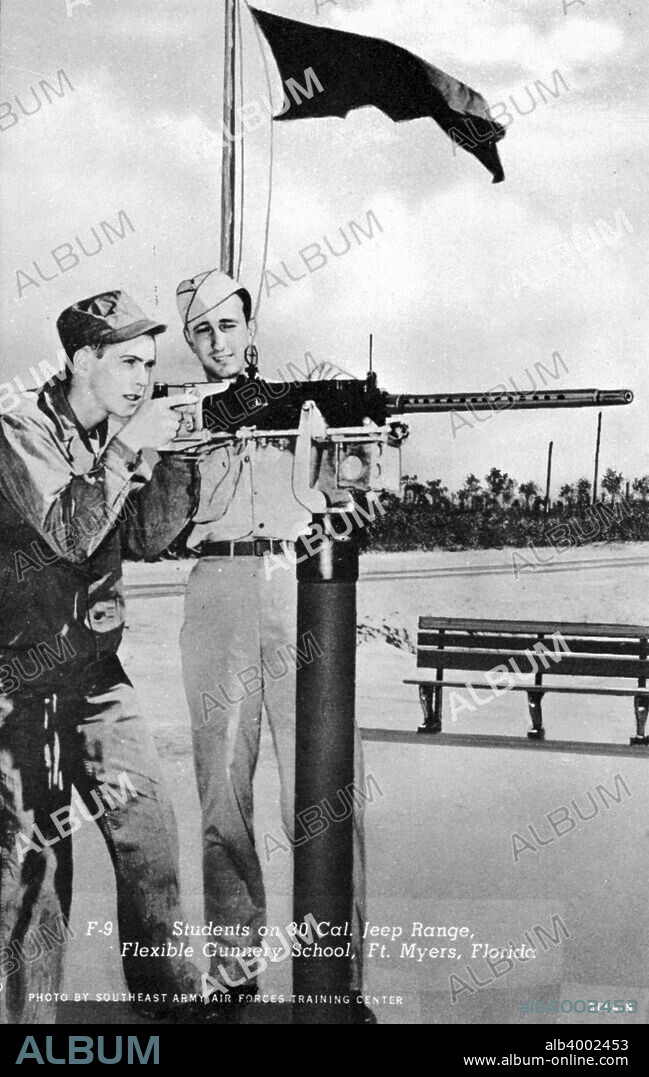 Students on a 30 cal machine gun range, Flexible Gunnery School, Fort Myers, Florida, USA, 1943. Postcard. View showing a soldier about to fire a mounted automatic weapon.