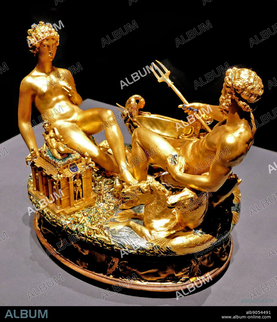 Photograph of the Cellini Salt Cellar (Saliera), a part-enamelled gold table sculpture, by Benvenuto Cellini. It was completed in 1543 for Francis I of France, from models that had been prepared many years earlier for Cardinal Ippolito d'Este. The Cellini Salt Cellar depicts a male figure representing the sea and a female figure that represents the earth. Benvenuto Cellini (1500-1571) an Italian goldsmith, sculptor, draftsman, solider, musician, and artist. Dated 16th Century.