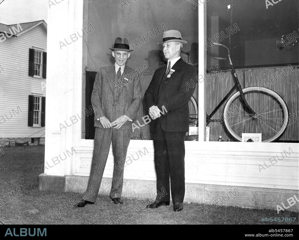 Transportation Pioneers -- Henry Ford (left), automotive pioneer, greeted Orville Wright (right), early aviation exponent, April 16 in front of the bicycle shop in which right and his brother, the late Wilbur right, constructed the ***** heavier-than-air flying machine. It was at Detroit, Mich., where the Wright shop and home, brought there from Dayton, O., by ford were formally dedicated. April 17, 1938. (Photo by Associated Press Photo).
