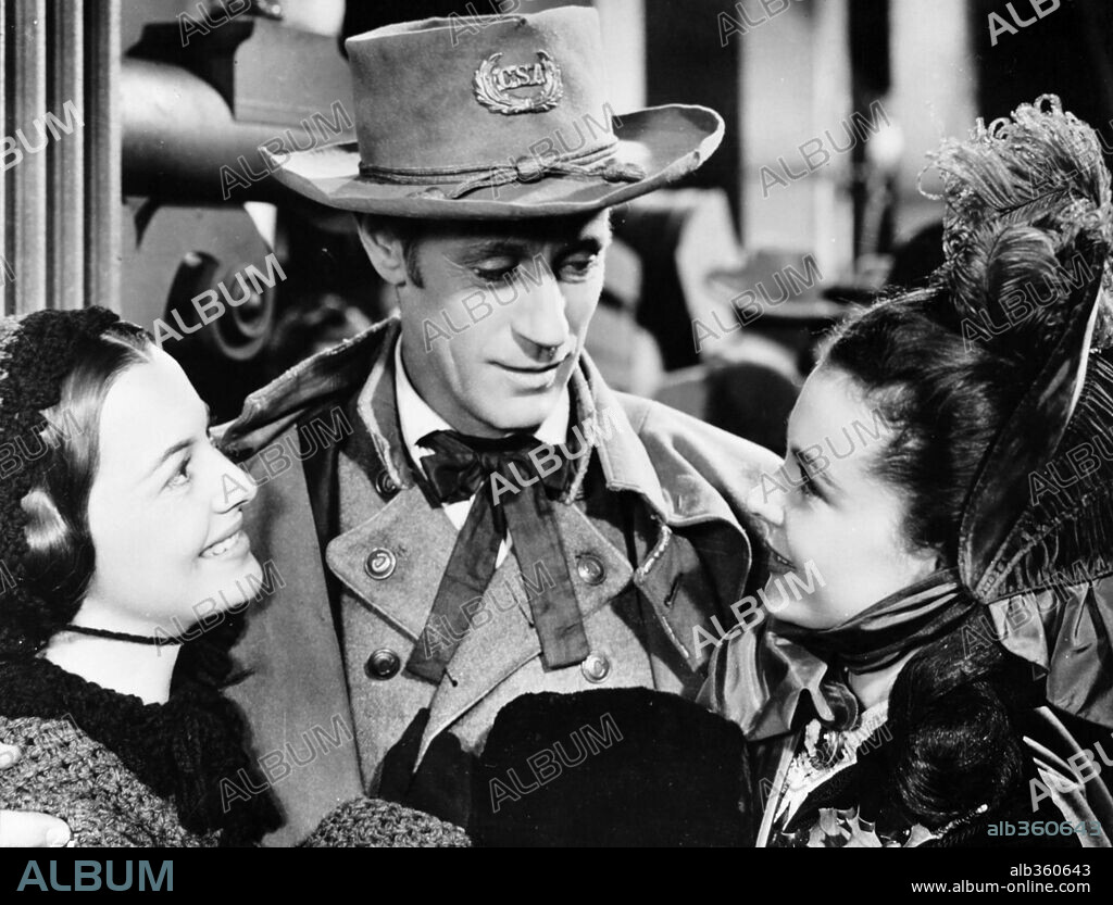 LESLIE HOWARD, OLIVIA DE HAVILLAND and VIVIEN LEIGH in GONE WITH THE WIND, 1939, directed by GEORGE CUKOR and VICTOR FLEMING. Copyright M.G.M.