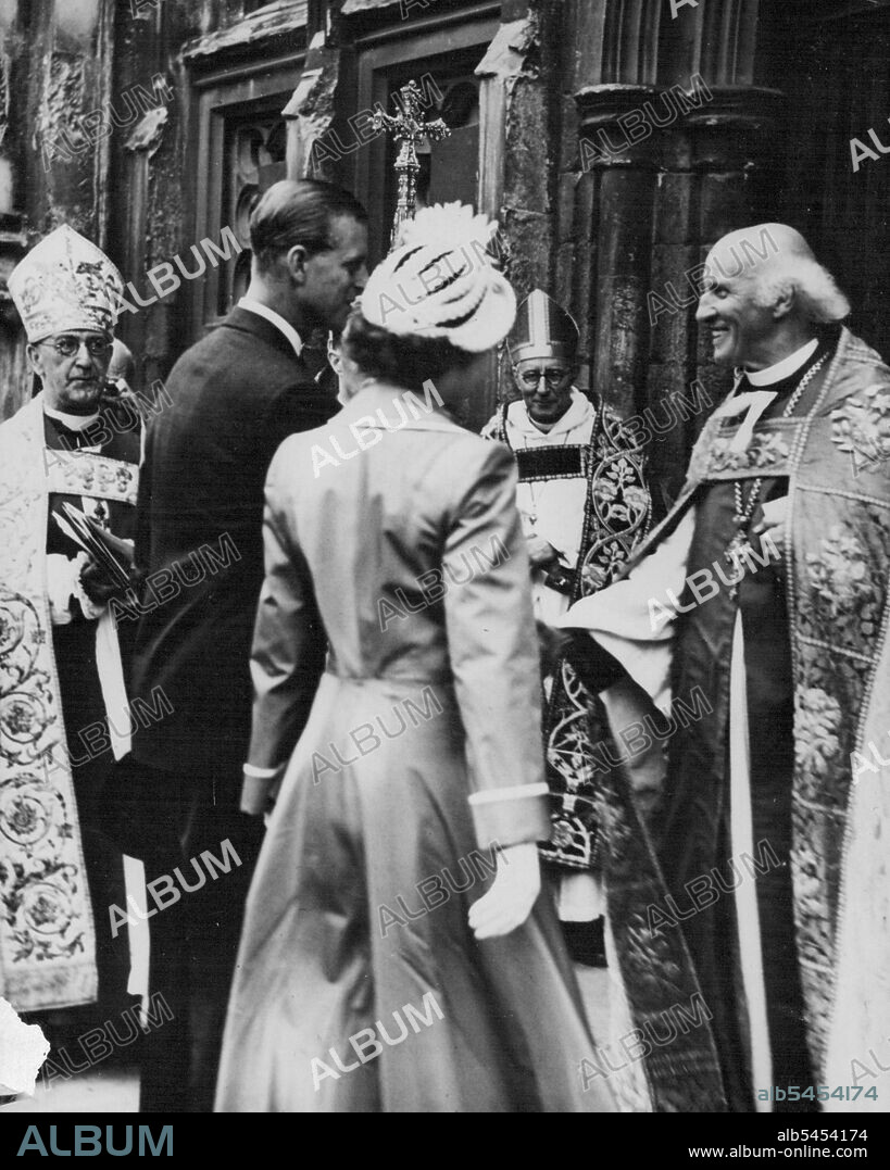 The Duke Meets the Dean -- The Very Rev, Hewlett Johnson, Dean of Canterbury, (right) receives Prince Philip at the West Door of Canterbury Cathedral, Kent, when he and Princess Elizabeth attended a service for the Kent Country playing fields Association, July 31. Prince Philip is President of the playing fields association of Great Britain. He and Princess Elizabeth were spending the week with lord and Lady Brabourne at Mersham Le watch Kent. August 12, 1949. (Photo by Associated Press Photo).