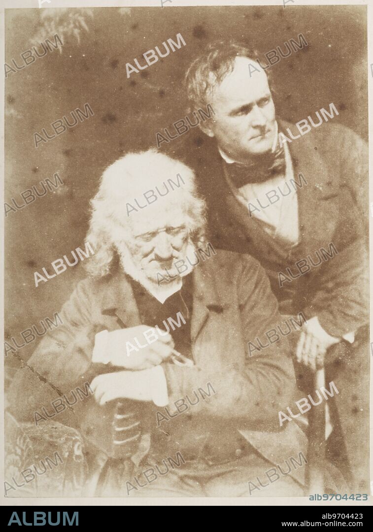 John Henning and A. H. Ritchie, sculptors. Half-length portrait. The older man, John Henning (1771-1851), is seated, his arms resting on a leather-bound volume. Alexander Handyside Ritchie (1804-1870) stands behind his left shoulder, his left hand resting on the chair back, looking off to the right.