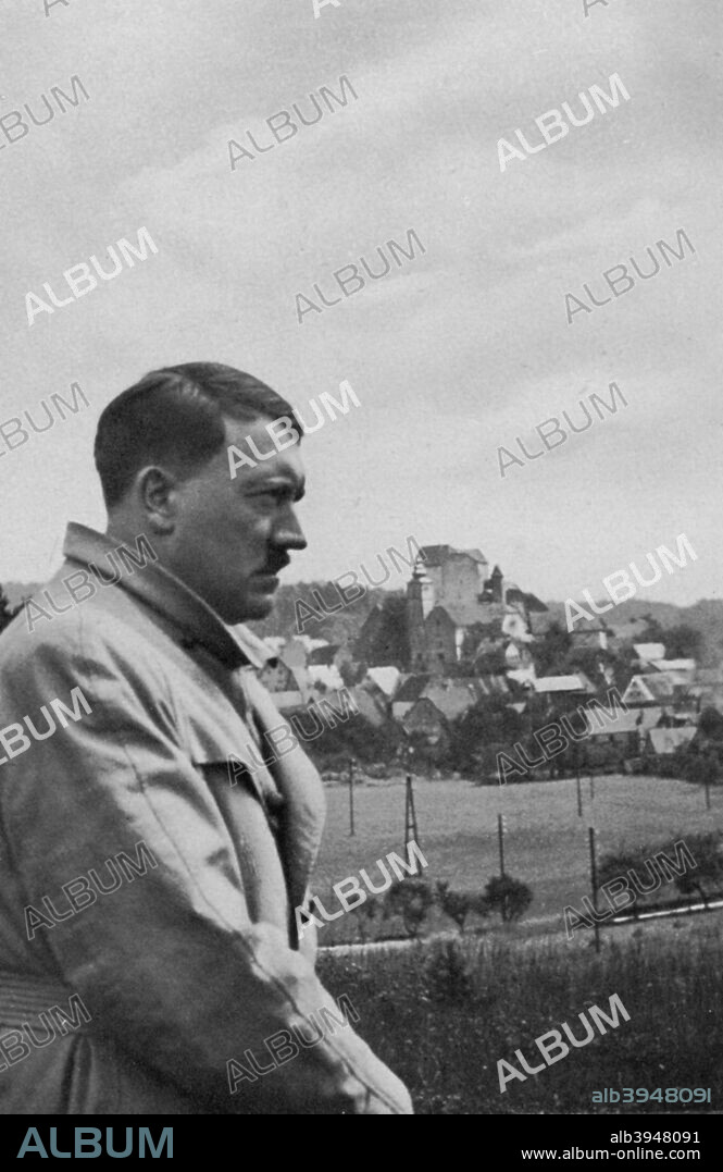 German Nazi leader Adolf Hitler, 1936. Hitler (1889-1945) with the German countryside around Hiltpoltstein in the background. A print from Adolf Hitler. Bilder aus dem Leben des Führers, Hamburg: Cigaretten/Bilderdienst Hamburg/Bahrenfeld, 1936.