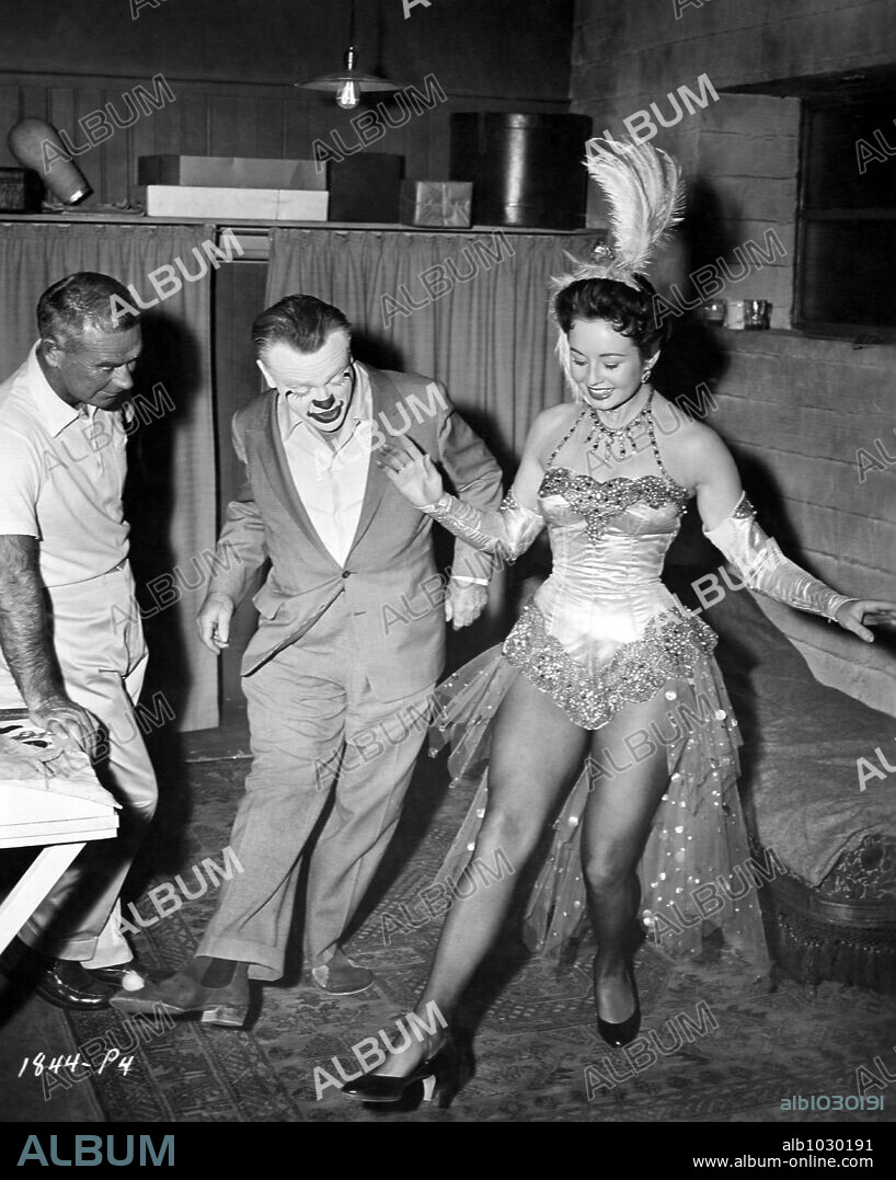 CAROL MORRIS, JAMES CAGNEY and KENNY WILLIAMS in MAN OF A THOUSAND FACES, 1957, directed by JOSEPH PEVNEY. Copyright UNIVERSAL PICTURES.