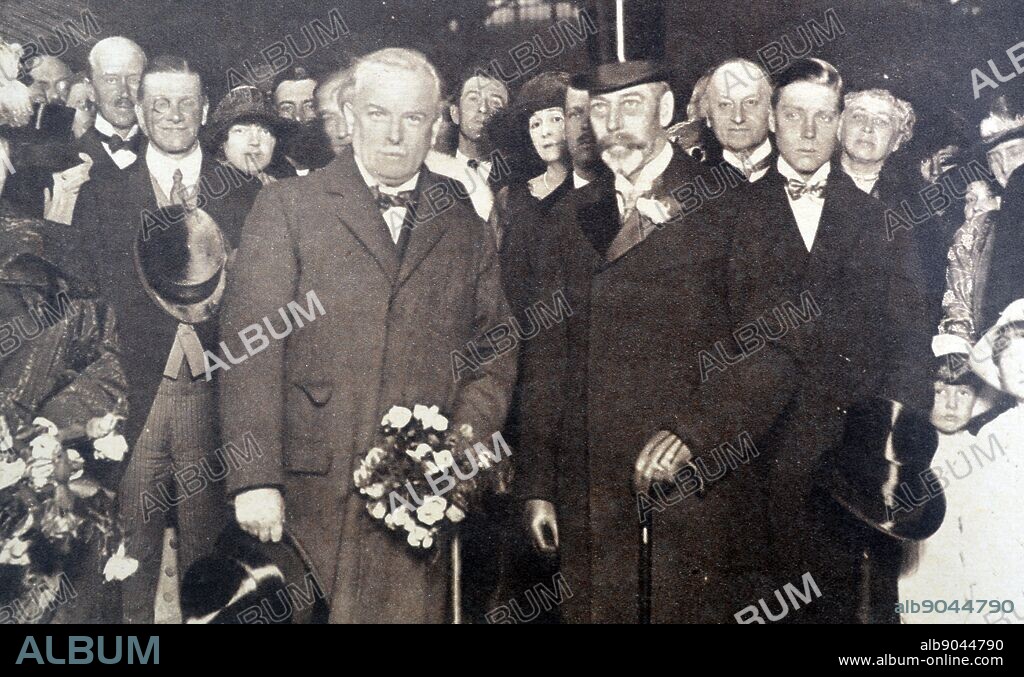 Photograph of King George V (1865-1935) and Mr David Lloyd George (1863-1945) at Victoria Station upon George's return from Paris and the Peace Conference. Dated 1919.