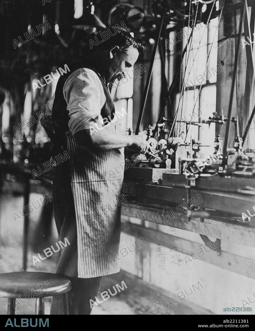 Watch Co., (6 boys of questionable age, but could not get photo of them.) These machines automatically make the tiny screws used in watches: One man tends to 14 machines. A lesson for glass works Mgrs.
