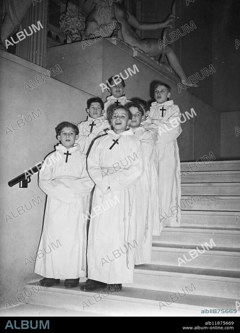 The French boys choir "Petits Chanteurs a la Croix de Bois", is to give this series of concerts in England. The lads, who come from French working-class families range from the age of 12 to 16. Picture shows: Some of the younger members of the choir of little singers of the wooden cross photographed at the French Institute, Kensington, London. 19 November 1946.