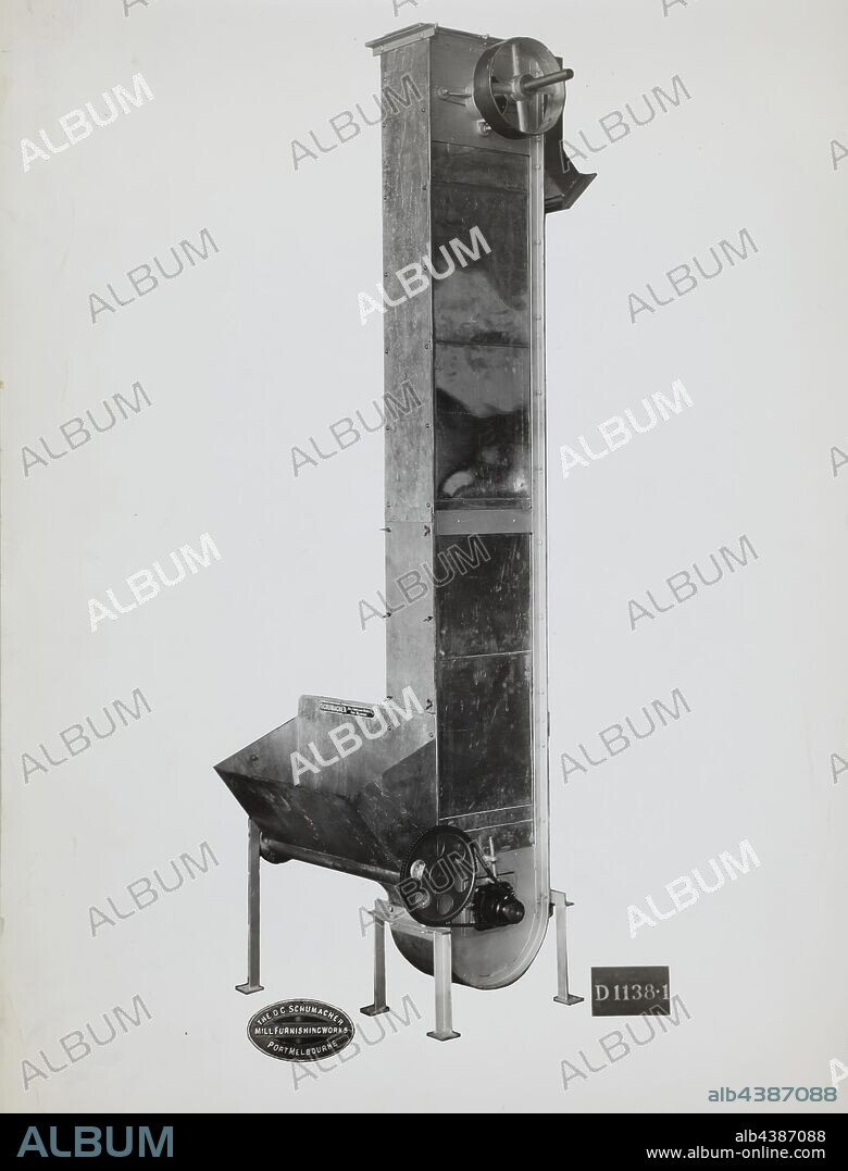Photograph - Schumacher Mill Furnishing Works, Bucket Elevator, Port Melbourne, Victoria, circa 1940s, Black and white promotional image of a bucket elevator. It is part of a collection of photographs and marked printer's copy used in the preparation of trade literature promoting products manufactured by the Schumacher Mill Furnishing Works Pty Ltd. The items were originally housed in a wooden filing drawer.