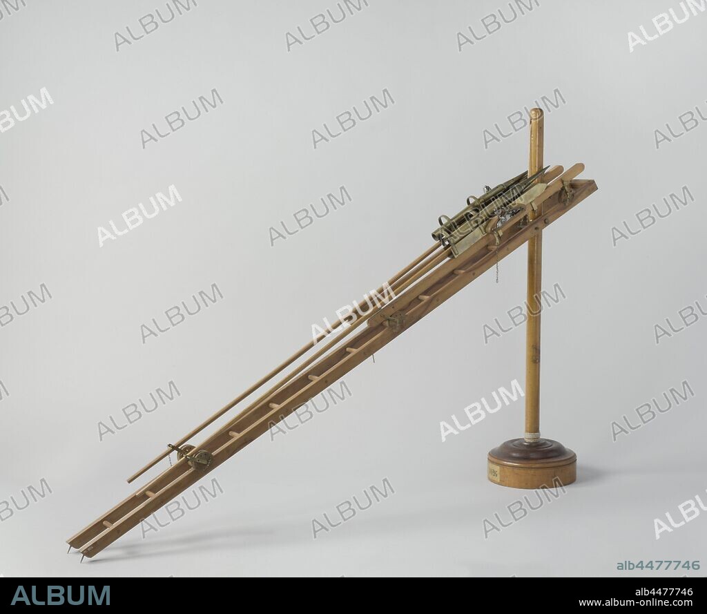 Model of Two Congreve Rockets with Launching Gear, Model of two fire rockets on a launcher or chair, for placement on a sloop. The rockets themselves consist of a pointed cylinder, the tip of which is the fire bomb and the rear part is the rocket engine, a long stabilizing pole is mounted on the outside of the cylinder. The chair is a ladder-shaped frame with a race ring suspended around a mast, which stands on a round base, with a fall over the disc at the top of the mast, the frame is hoisted and lowered for aiming and loading. A beam with a metal chamber and flint lock is mounted on each leg of the frame with a set of brackets. The flint locks have tractors with holes for a tractor rope. The head of the rocket is placed under two brackets in the room. The spark from the flint lock is bounced off a plate in the room to get to the back of the rocket., Rijkswerf Rotterdam (attributed to), 1804 - 1805 and/or c. 1818, wood (plant material), brass (alloy), iron (metal), leather, rope, mast: h 73.8 cm frame: l 123.5 cm × w 13.5 cm.