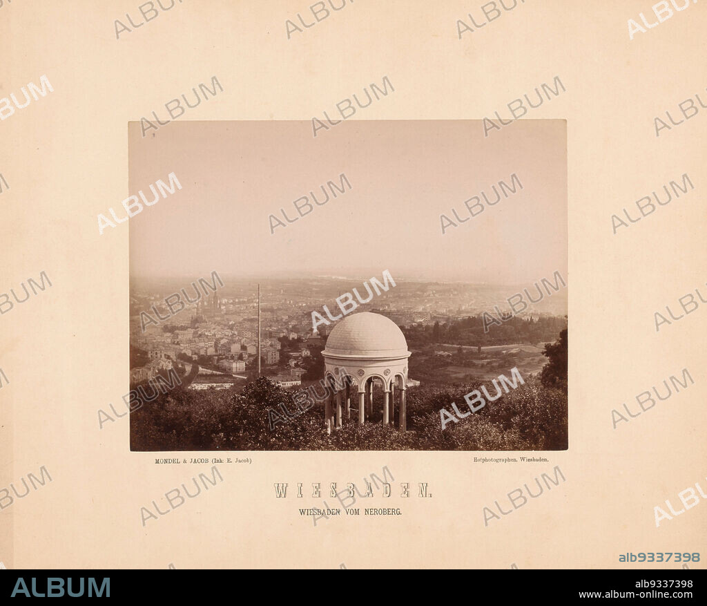 View of Wiesbaden, seen from the Neroberg, Wiesbaden vom Neroberg (title on object), View of Wiesbaden, seen from just behind the Monopteros on the Neroberg., Mondel & Jacob (mentioned on object), Wiesbaden, 1870 - 1890, paper, cardboard, albumen print, height 168 mm × width 223 mmheight 305 mm × width 376 mm.