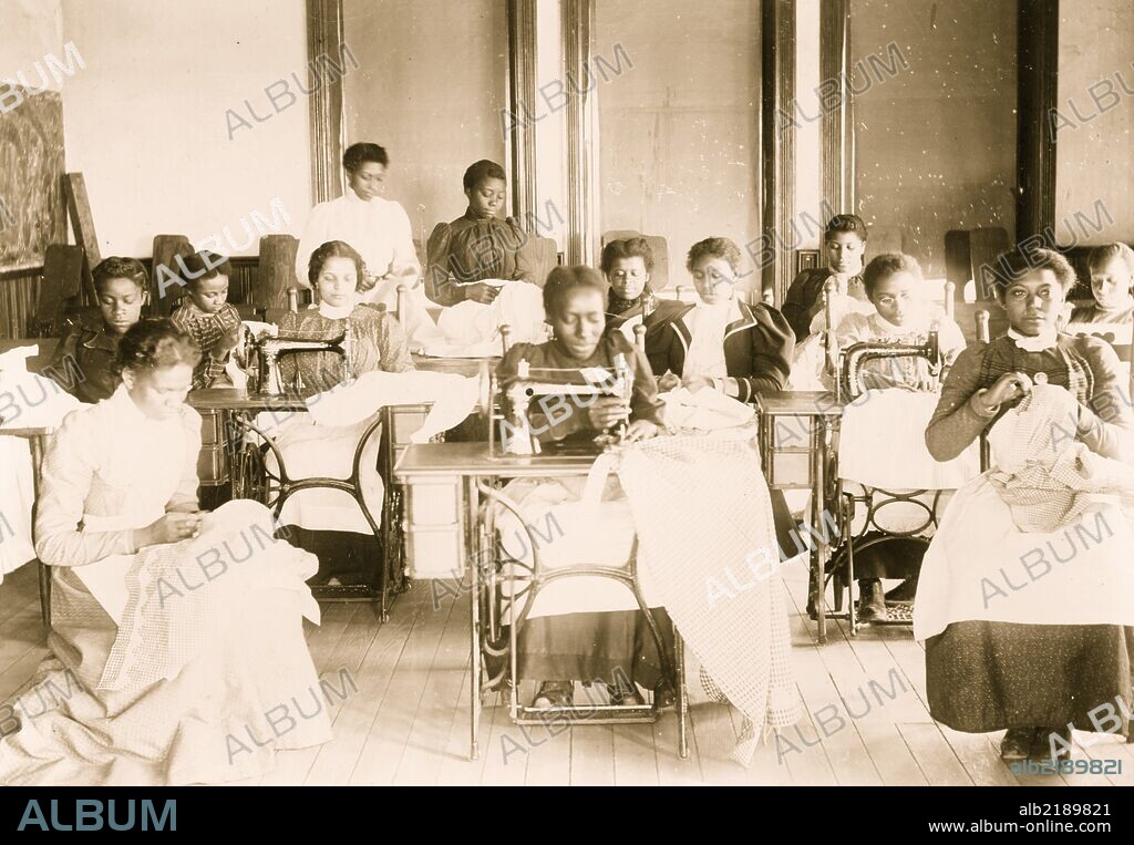Young women sewing with machines and by hand in the sewing class at the Agricultural and Mechanical College, Greensboro, N.C.