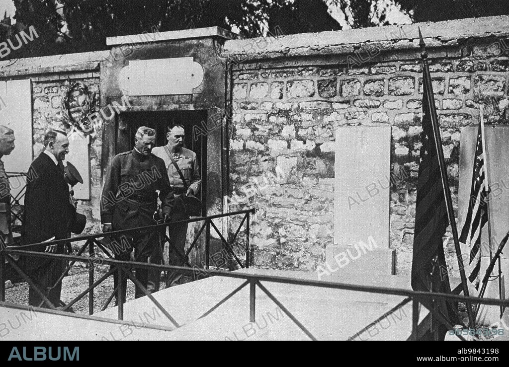 'La Visite de Pershing a La Fayette; Le general, devant la tombe de La Fayette: a sa droite, en vetements civils, le marquis de Chambrun, deputé de la Lozere, descendant de La Fayette, qui avait partie de la mission Joffre-Viviani aux Etats-Unis', 1917. First World War: the visit of General Pershing to (the tomb of) Lafayette; at left is the Marquis de Chambrun, MP for Lozere, descendant of Lafayette, who was part of the Joffre-Viviani mission to the United States. From "L'Album de la Guerre 1914-1919, Volume 2" [L'Illustration, Paris, 1924].