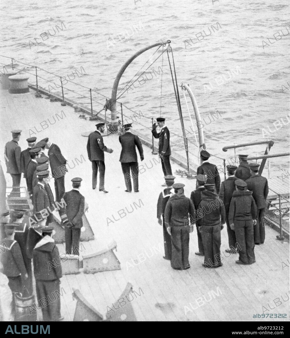 August 1916. A Marine Prince. Prince Albert of England (1) Greeting his Father, King George V (2), during his visit to the battleship on which he serves as an ensign of the navy.