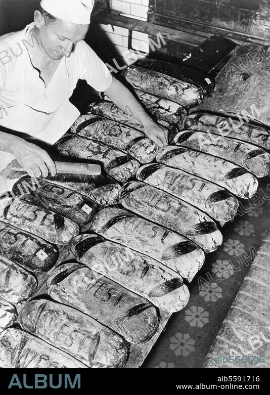 Berlin, 1950. Marking bread made in West Berlin bakeries to distinguish it from the state-subsidized bread of the 'HO' (Handelsorganisation-trade organization) shops in East Berlin. Photo, 8 October 1950.