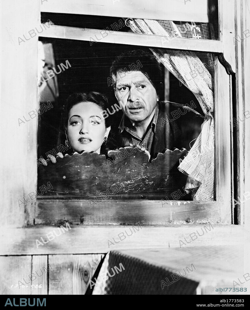 DOROTHY LAMOUR and J. CARROL NAISH in A MEDAL FOR BENNY, 1945, directed by IRVING PICHEL. Copyright PARAMOUNT PICTURES.