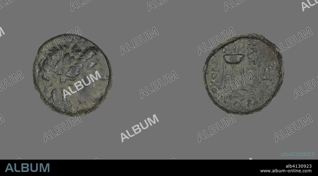 ANCIENT GREEK. Coin Depicting the God Apollo. Greek. Date: 261 BC-246 BC. Dimensions: Diam. 1.7 cm; 5.11 g. Copper. Origin: Ancient Greece.