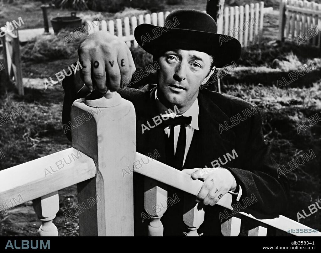 ROBERT MITCHUM in THE NIGHT OF THE HUNTER, 1955, directed by CHARLES LAUGHTON. Copyright UNITED ARTISTS.