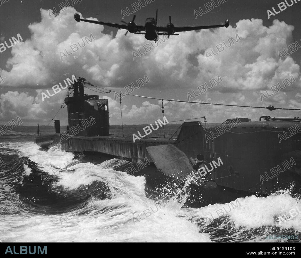 Combined Air Naval Exercises Off Manus Island Now Proceeding: British submarine "Thorough" being attacked by Anti Sub Neptune Bomber. October 15, 1954. (Photo by Alton L. Frazer, Australian Photographic Agency Picture).