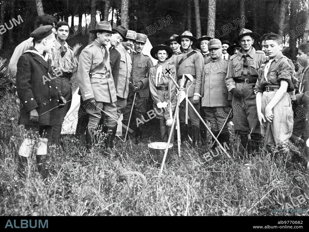 June 1916. A "Boy-Scout" Prince. The heir to the throne of Italy, Umberto, prince of Piedmont (X), visiting the camp of the Italian Explorers in Villa Savoia (Rome).