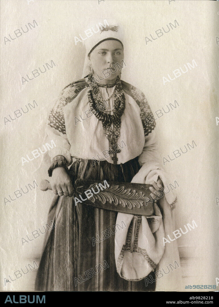 Young woman from Western Russia, Smolensk Governorate in traditional cultural folk dress - ca. 1900.